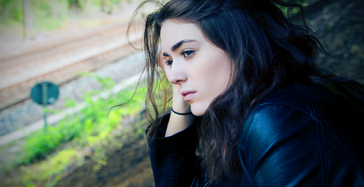 Young person staring into space