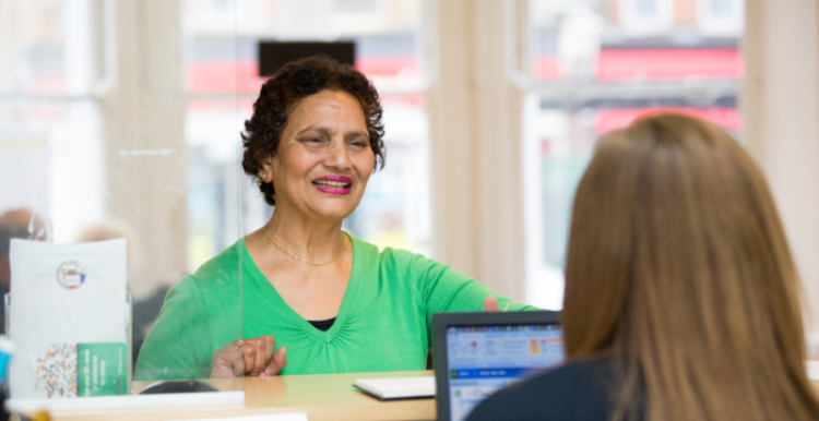 lady talking to receptionist