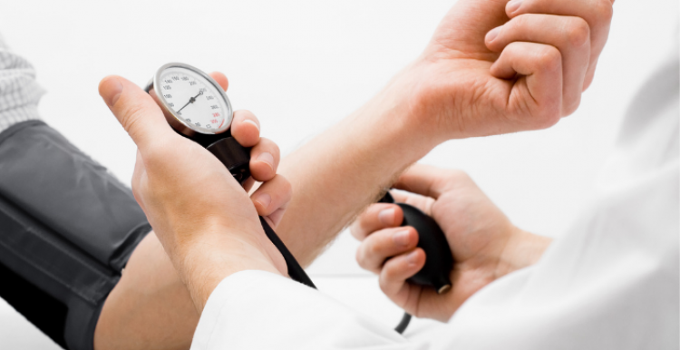 Person having blood pressure checked