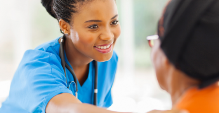 Nurse smiling at patient