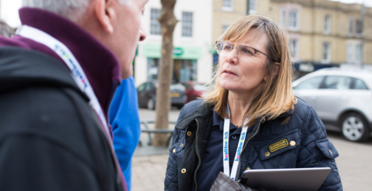 Lady talking to a member of the public