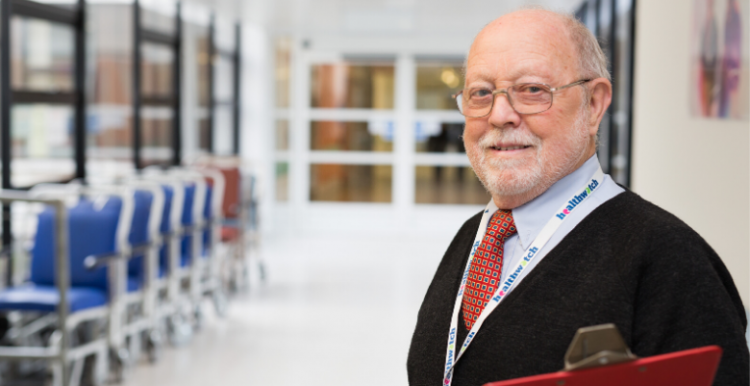 older man in hospital corridor