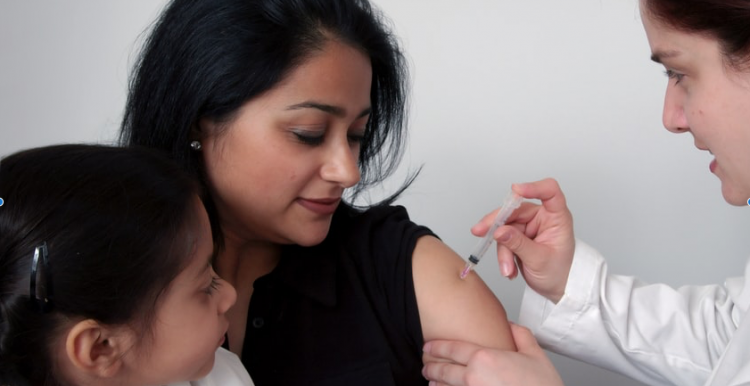 lady receiving vaccine