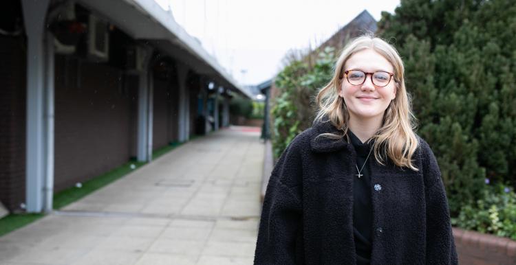 girl standing outside smiling