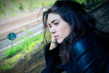 Young person staring into space