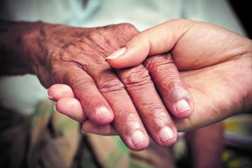 Two people holding hands