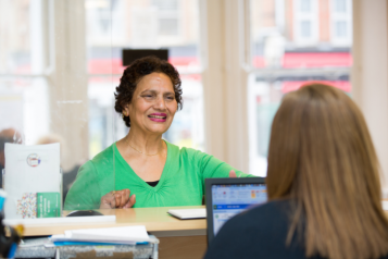 lady talking to receptionist