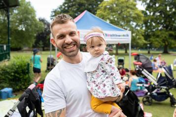 Man with baby outside 