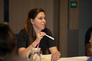 Person sitting at a table talking