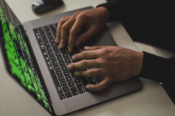 person typing on computer