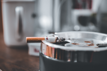 Burning cigarette on an ashtray