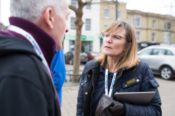 Lady talking to a member of the public