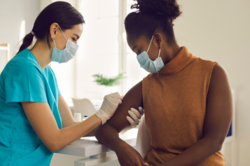 Woman receiving a vaccination