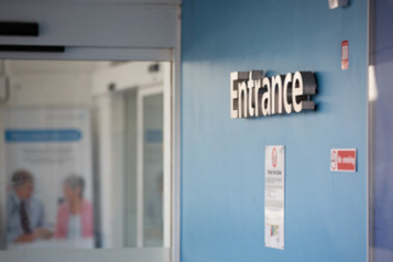 Entrance sign in a hospital corridor