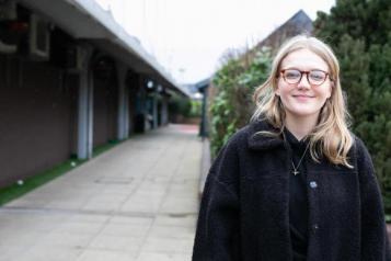 girl standing outside smiling