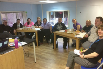 Group of volunteers with learning disabilities taking part in a training session