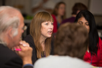 Lady talking to group