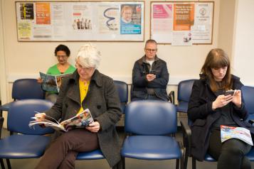 Group of people sitting in waiting room