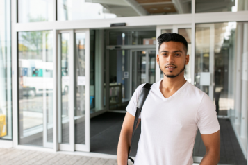 Young man standing outside a hospital