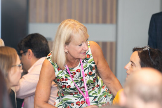 Healthwatch staff member talking to person sitting at table