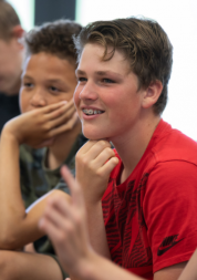 Boys smiling away from camera